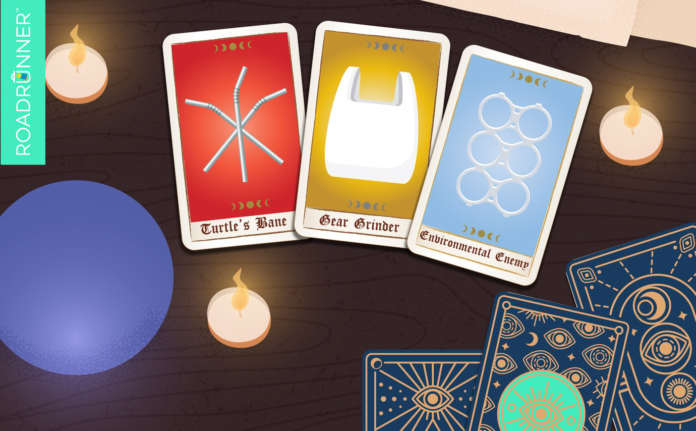 A crystal ball and candles next to three tarot cards with plastic straws, a plastic bag, and plastic six-pack ring.