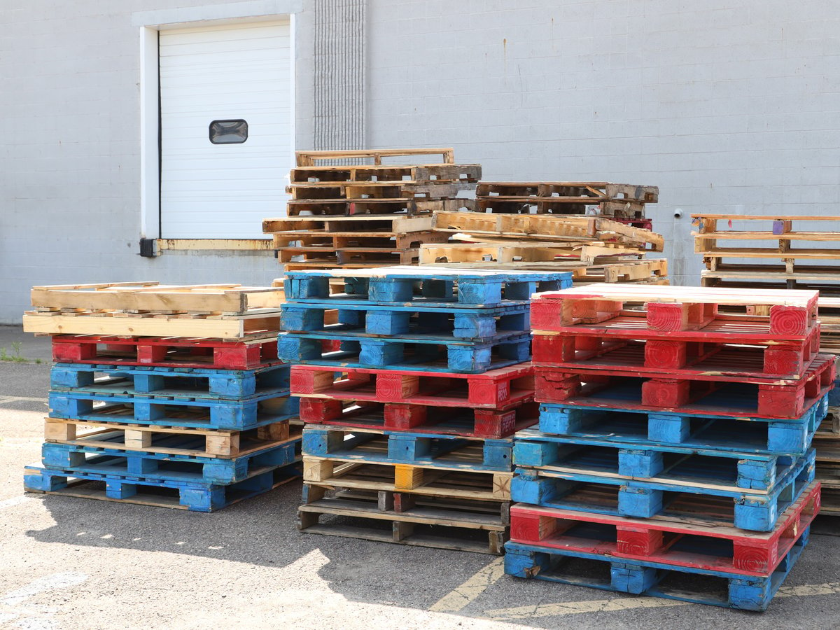 Stacks of pallets sitting at a loading dock