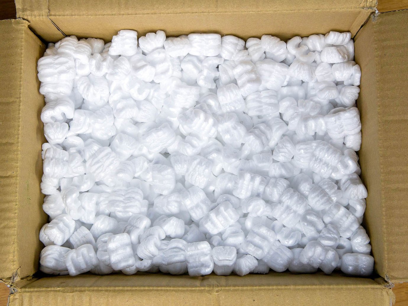 cardboard box filled with styrofoam packing peanuts