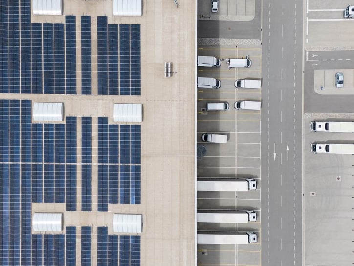 A logistics center with solar panels viewed from above.